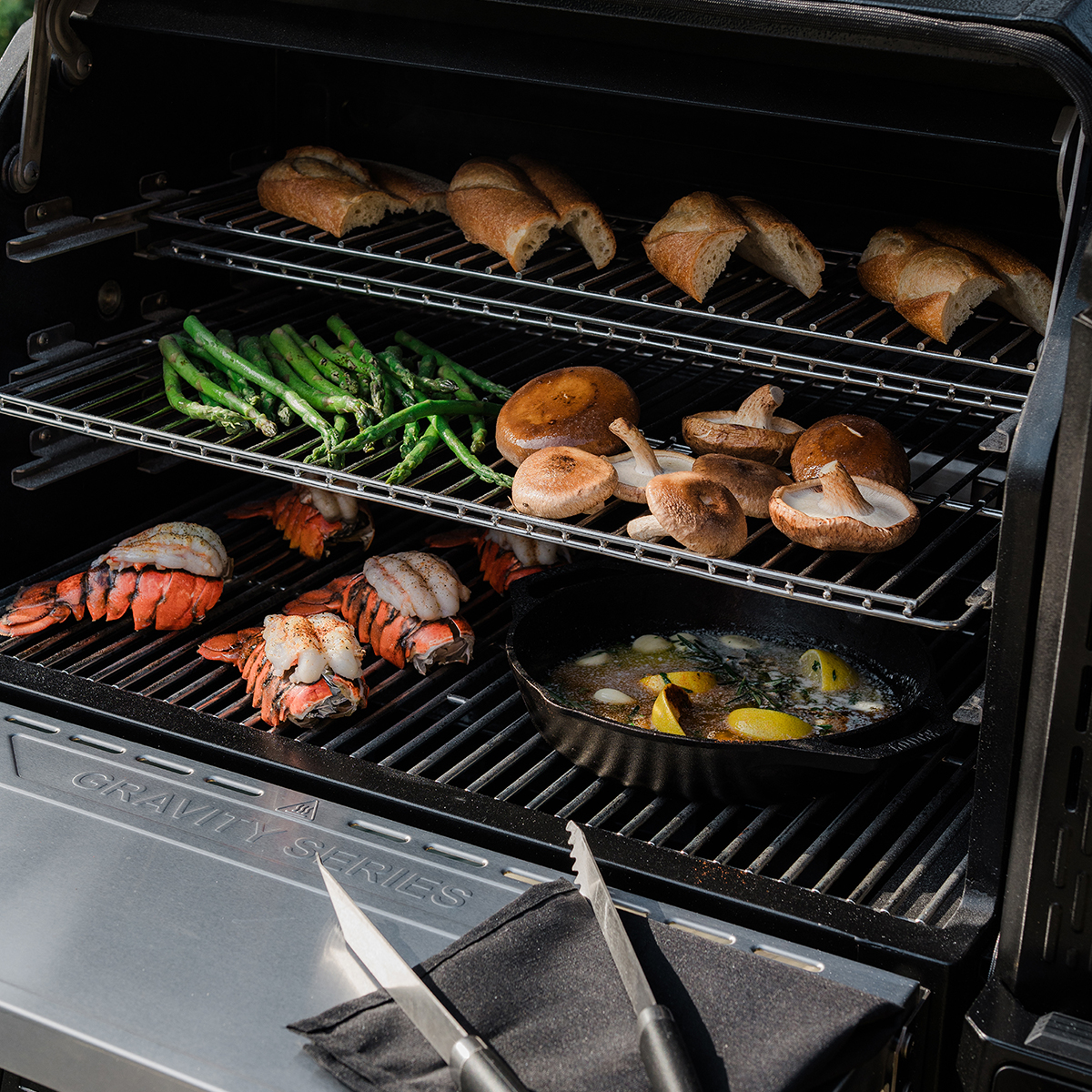 The FoldAway warming + smoking racks provide extra cooking space, while the stainless steel front shelf provides extra preparation space.